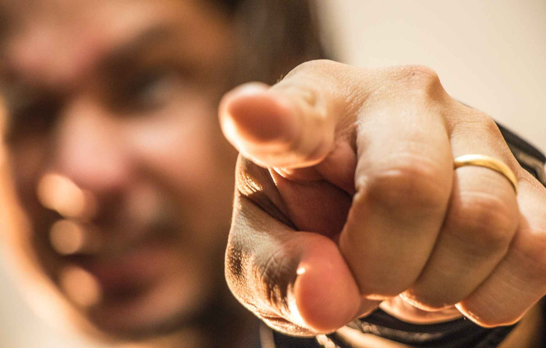 photo of man pointing his finger